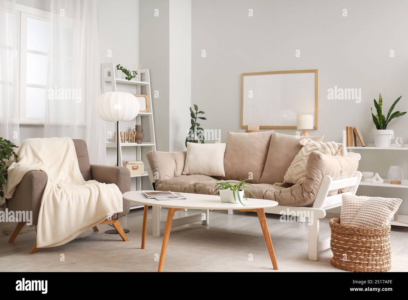 Interior of light living room with armchair, lamp and sofa Stock Photo ...