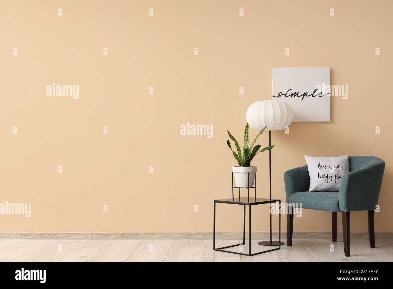 Interior of living room with armchair, lamp and table Stock Photo - Alamy
