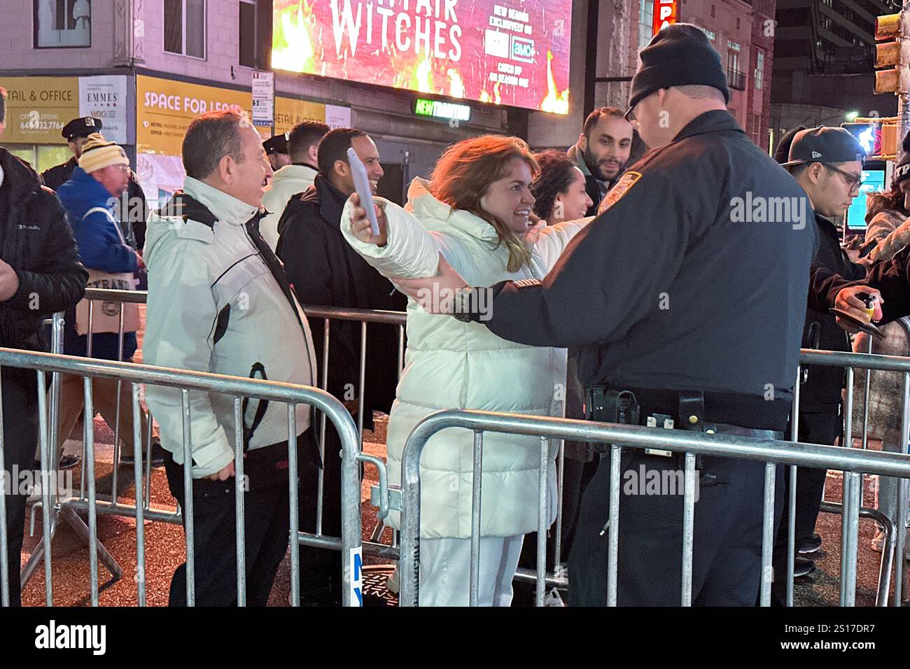 NYPD officers search people entering Times Square in New York for the ...