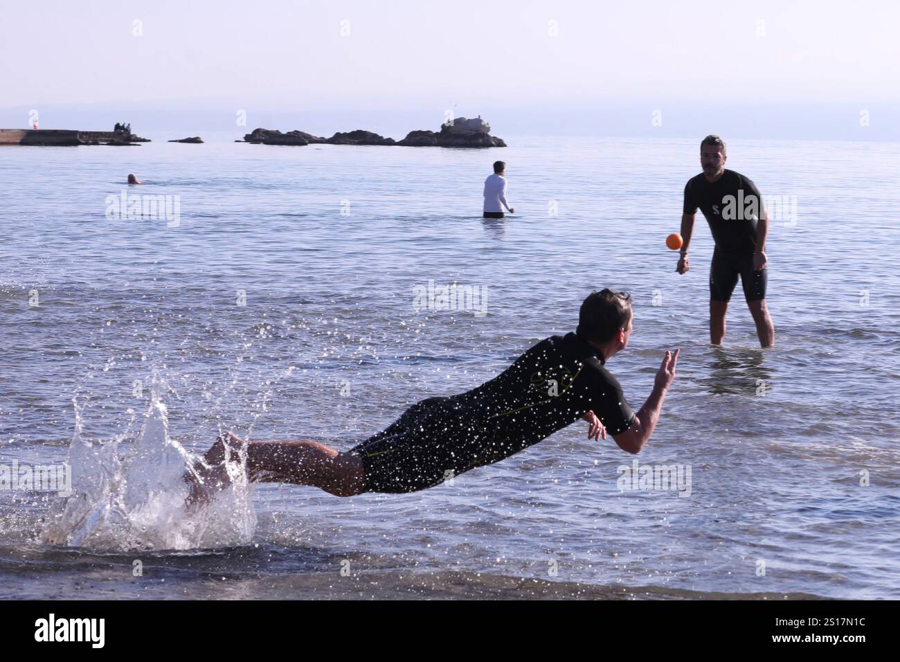People on first day of 2025. play with ball on Bacvice beach in Split