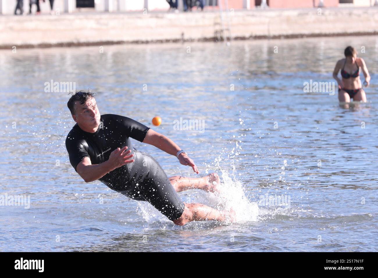 People on first day of 2025. play with ball on Bacvice beach in Split