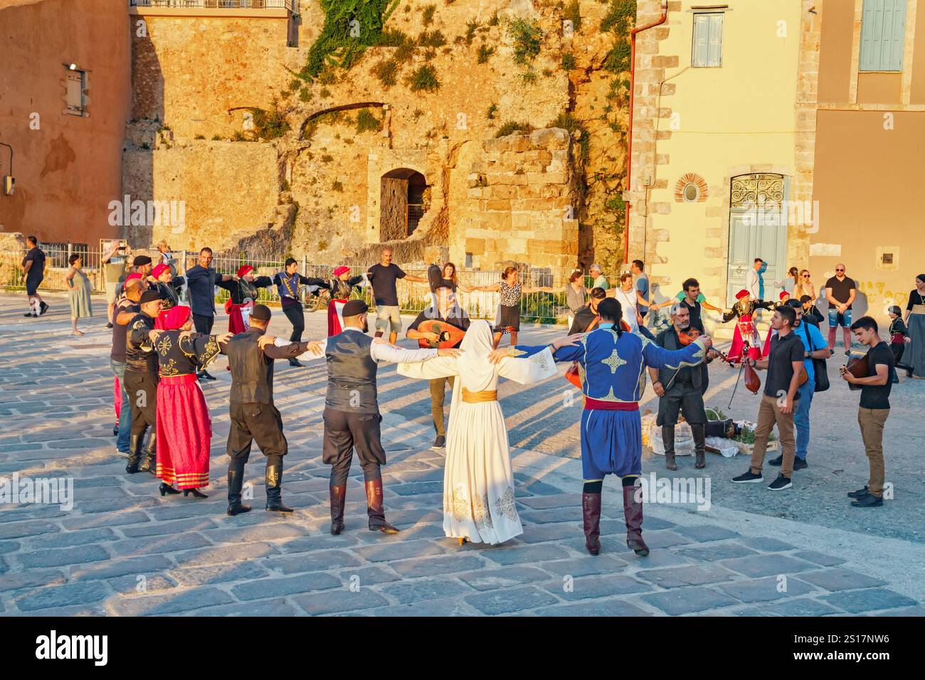 Group of people performing traditional Greek dance, Chania, Crete, Greek Islands, Greece Stock Photo