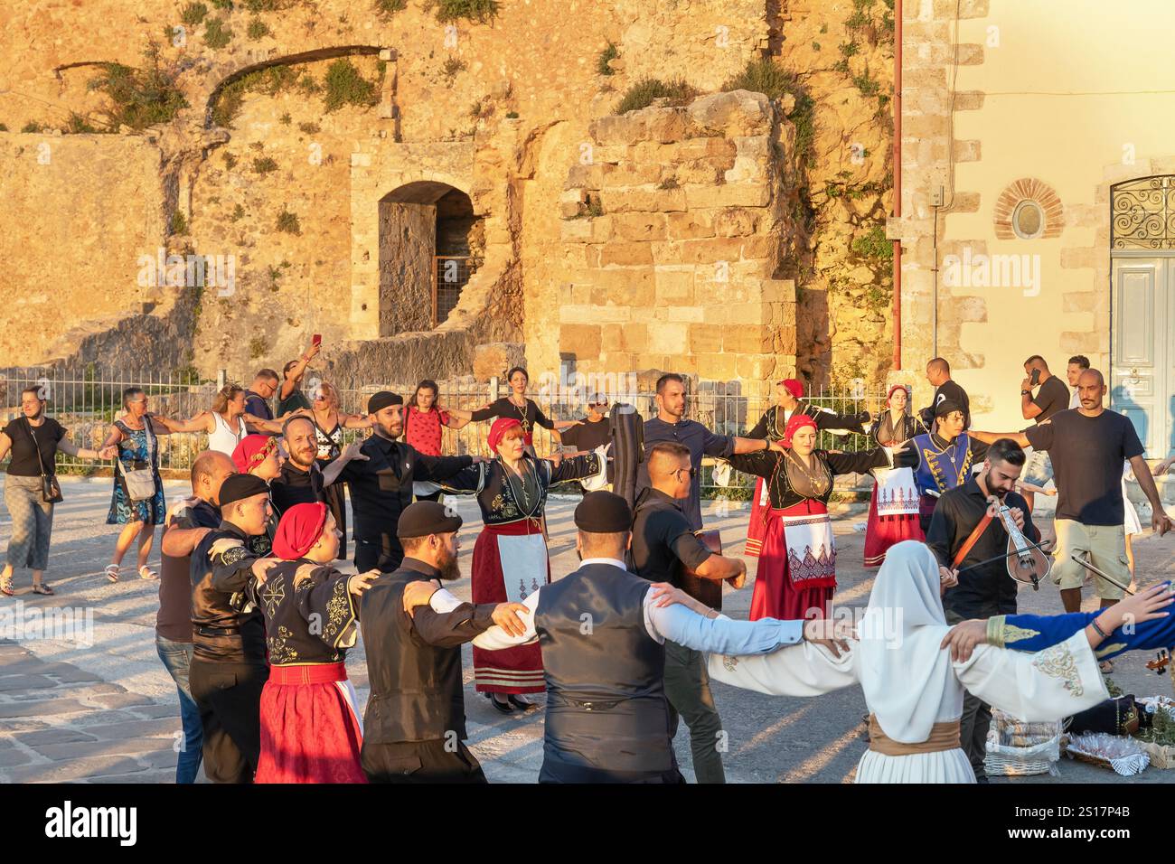 Group of people performing traditional Greek dance, Chania, Crete, Greek Islands, Greece Stock Photo