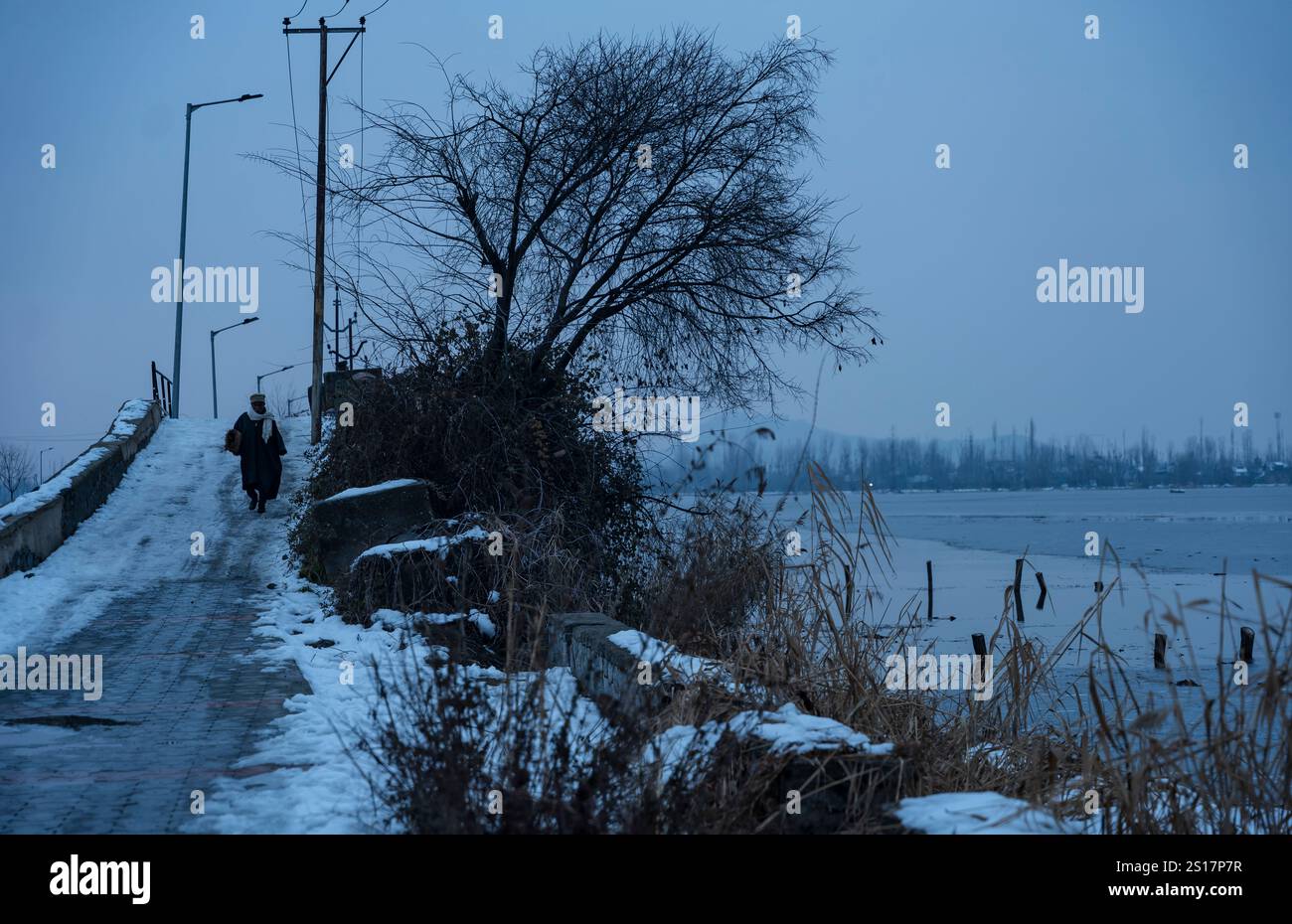 January 1, 2025, Srinagar, Jammu & Kashmir, India A man walks along a