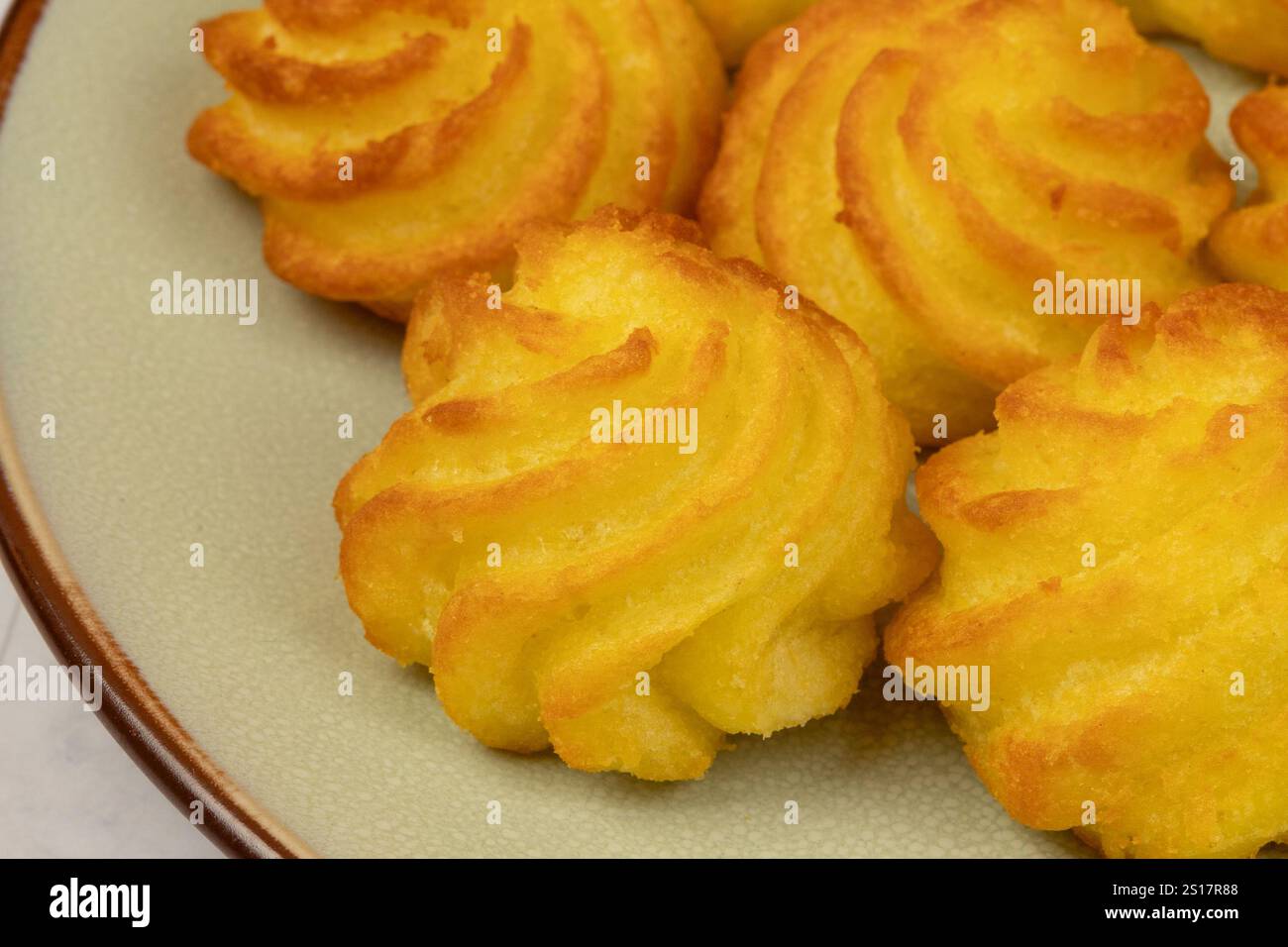 duchess potatoes on a plate Stock Photo