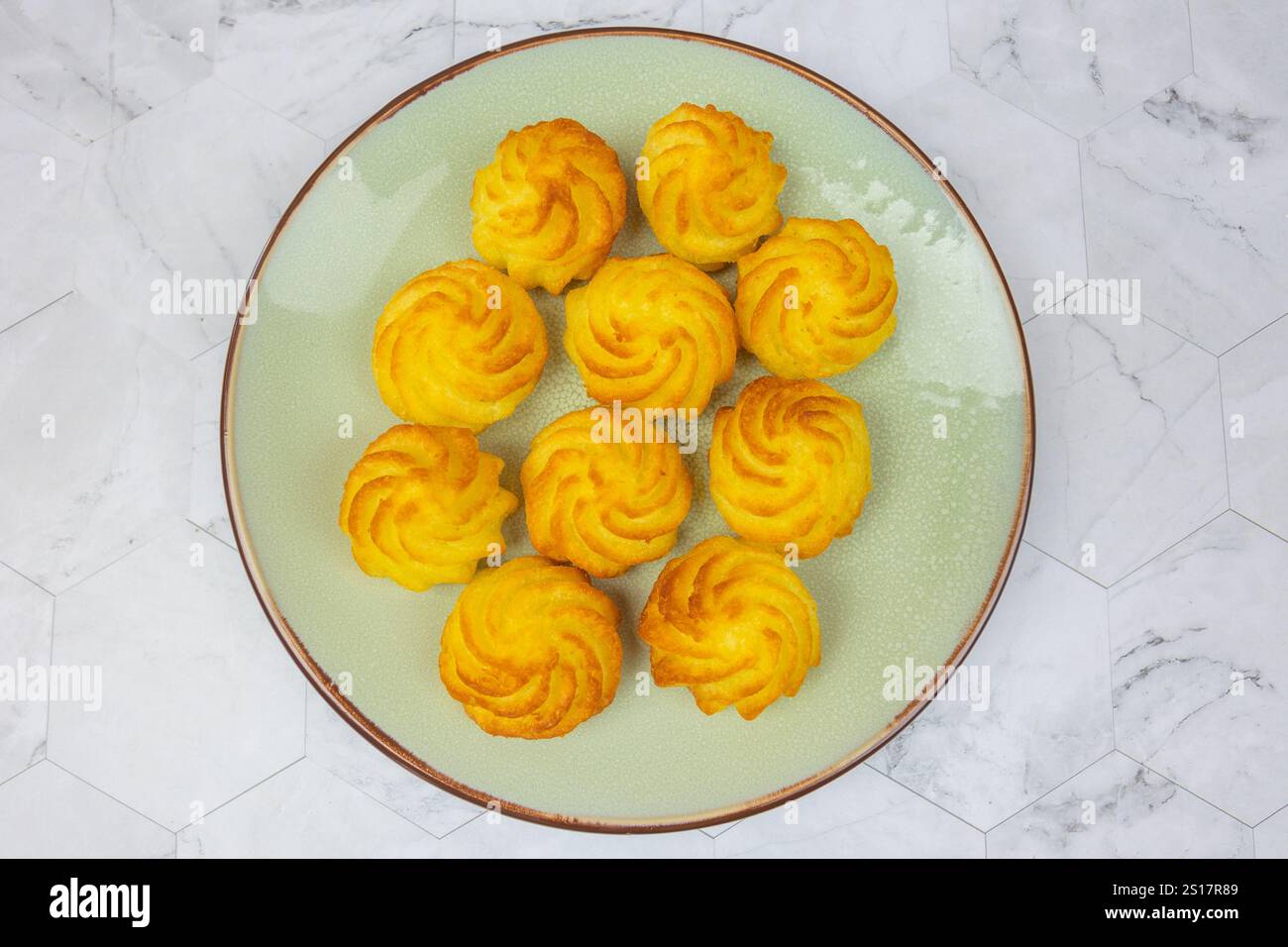 duchess potatoes on a plate Stock Photo
