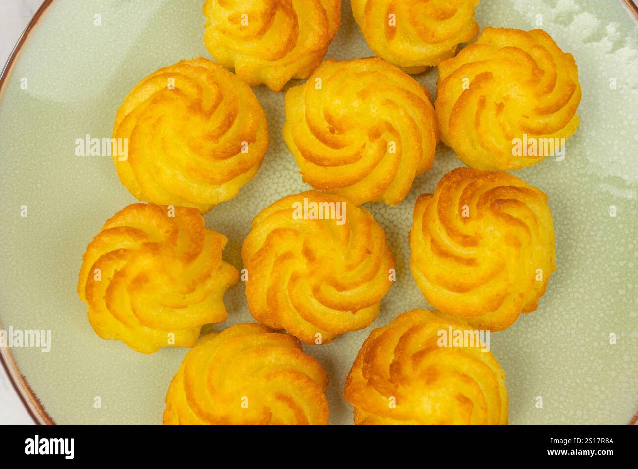 duchess potatoes on a plate Stock Photo