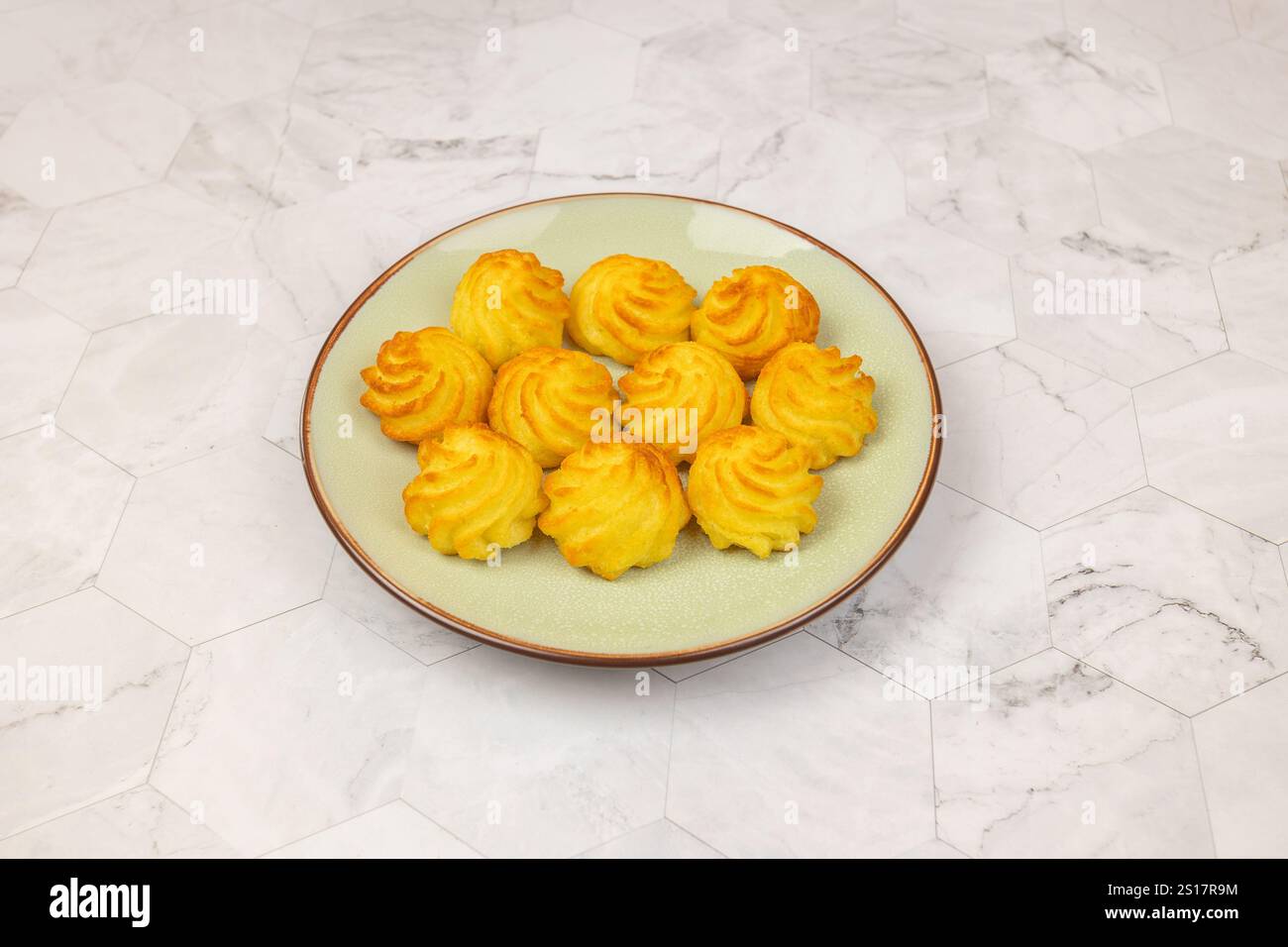 duchess potatoes on a plate Stock Photo