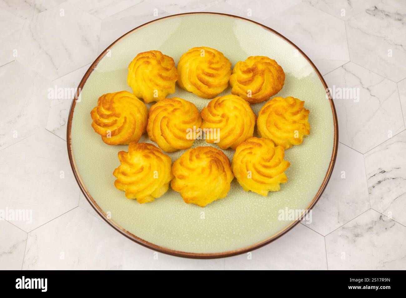 duchess potatoes on a plate Stock Photo