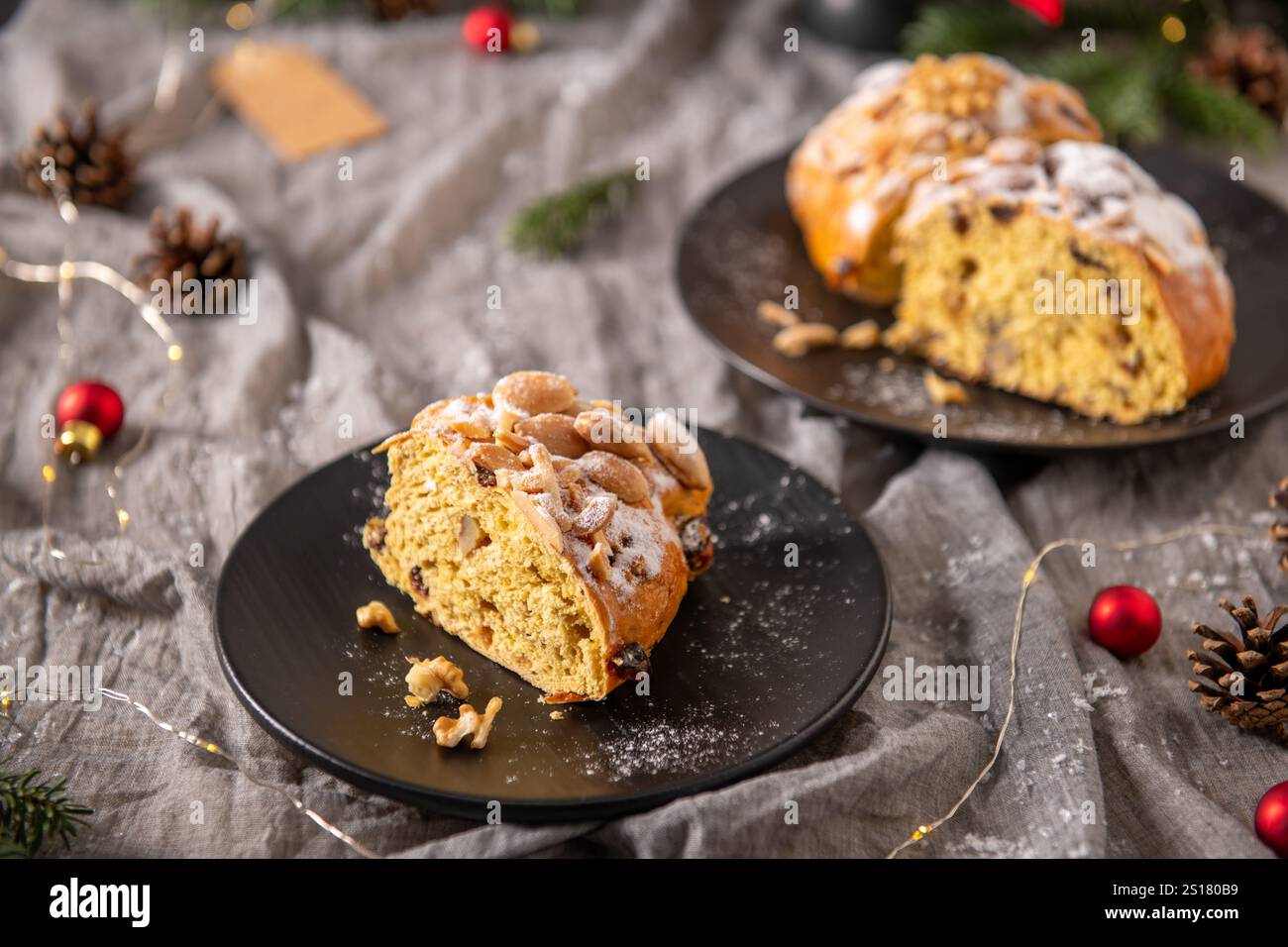 Two plates showcase Bolo Rainha, a Portuguese Christmas cake. One plate ...
