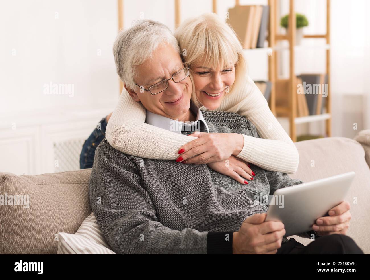 Senior couple using digital tablet, having video call Stock Photo