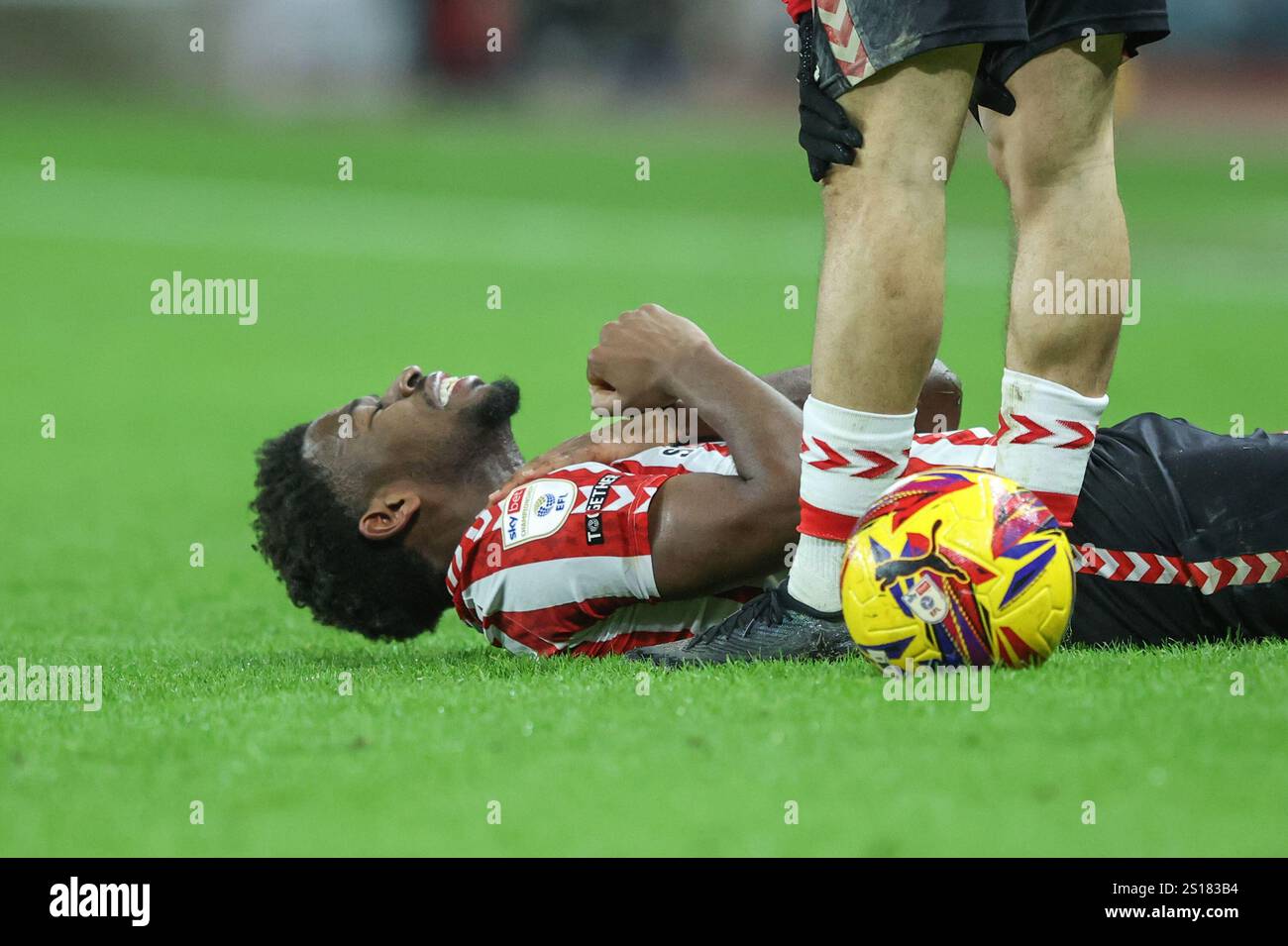 Aji Alese of Sunderland goes down during the Sky Bet Championship match