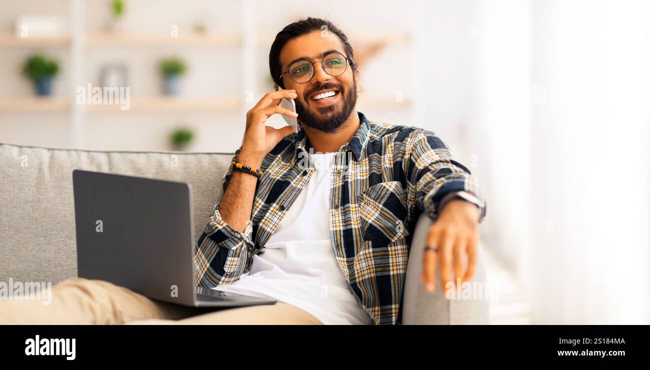 Joyful middle-eastern man freelancer working from home Stock Photo