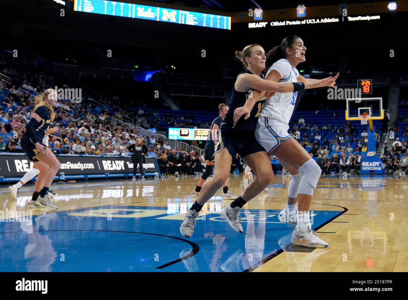 UCLA center Lauren Betts (51) fights for position with Michigan guard