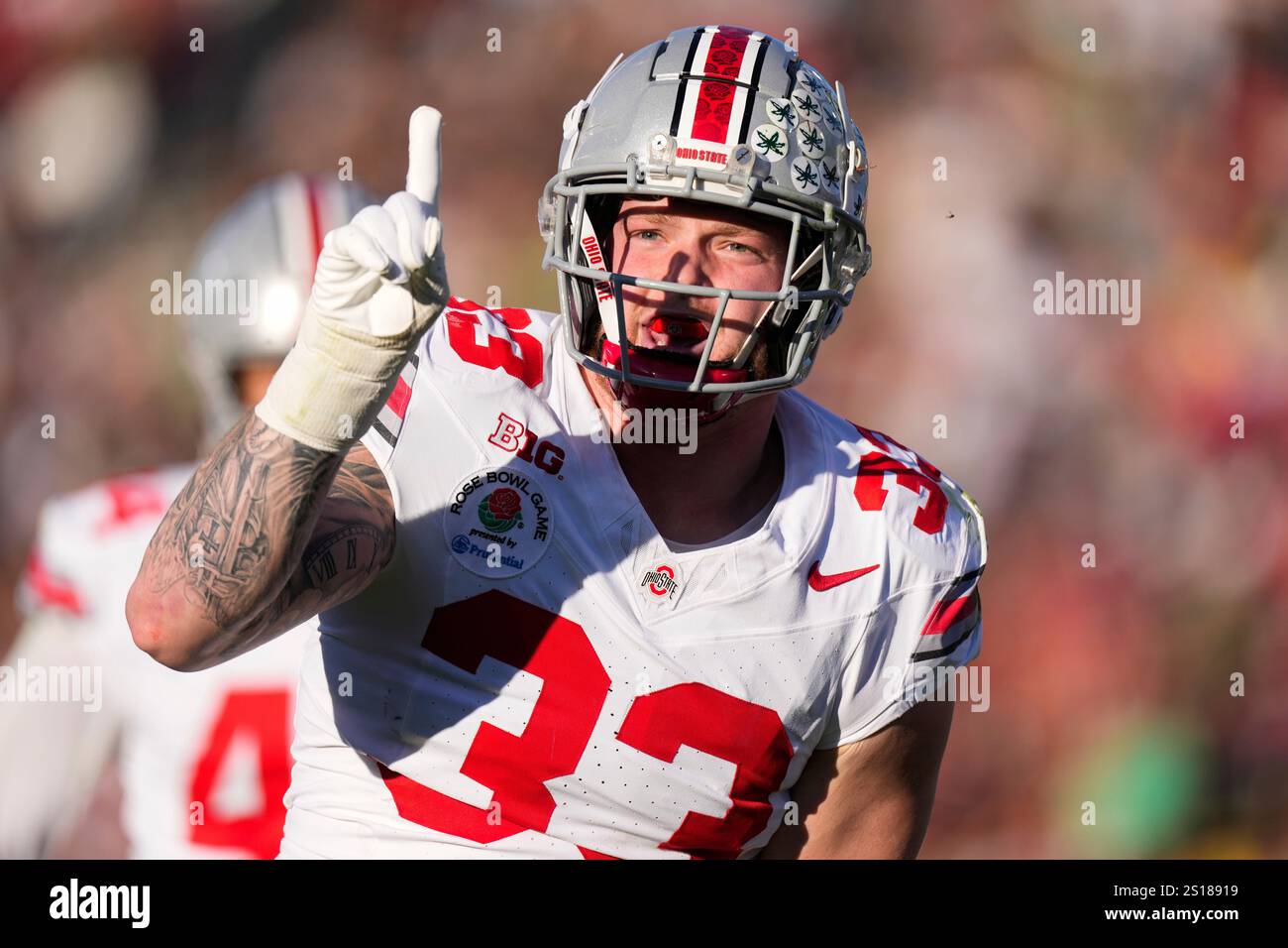 Ohio State defensive end Jack Sawyer (33) celebrates blocking a pass