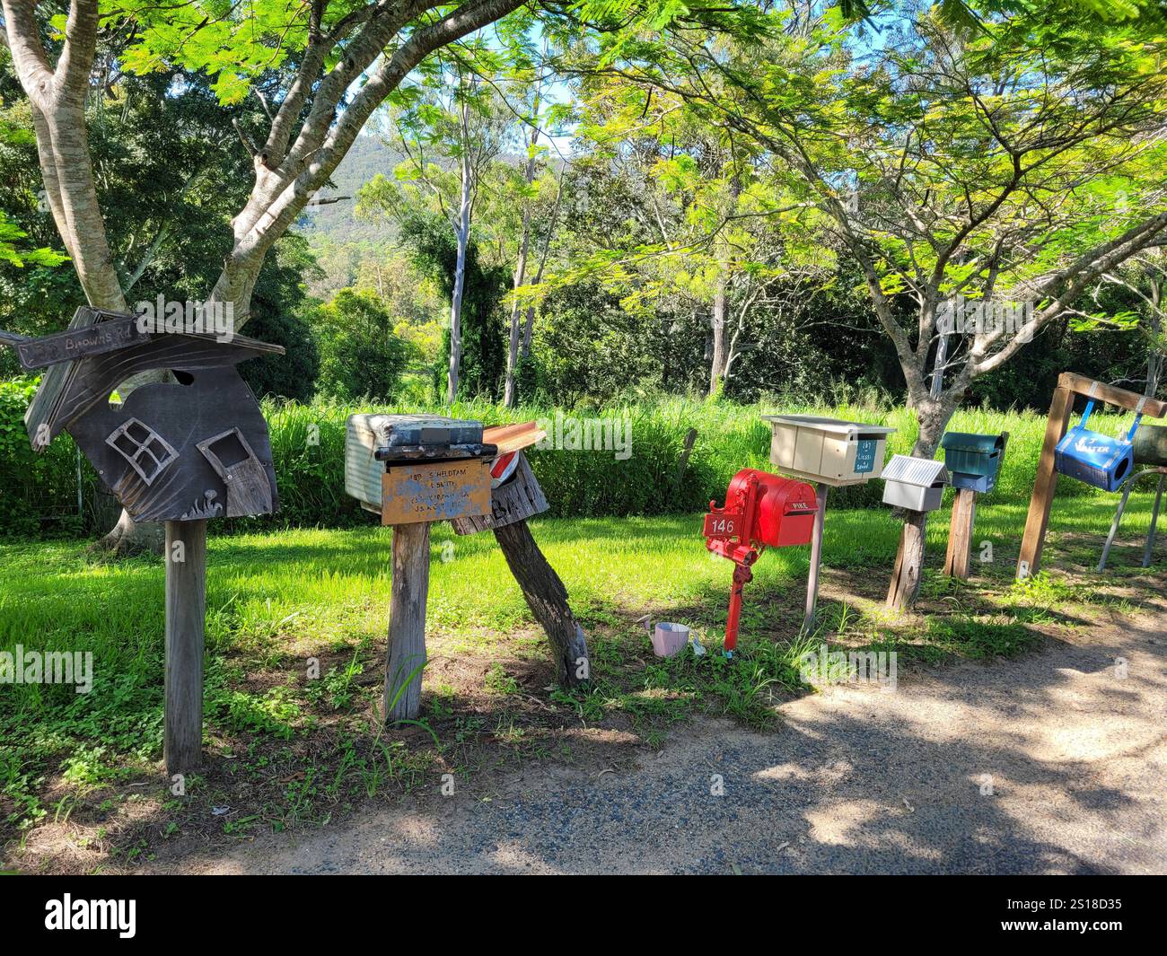 A row of rustic rural postboxes, Stamford Valley, Queensland, QLD, Australia Stock Photo