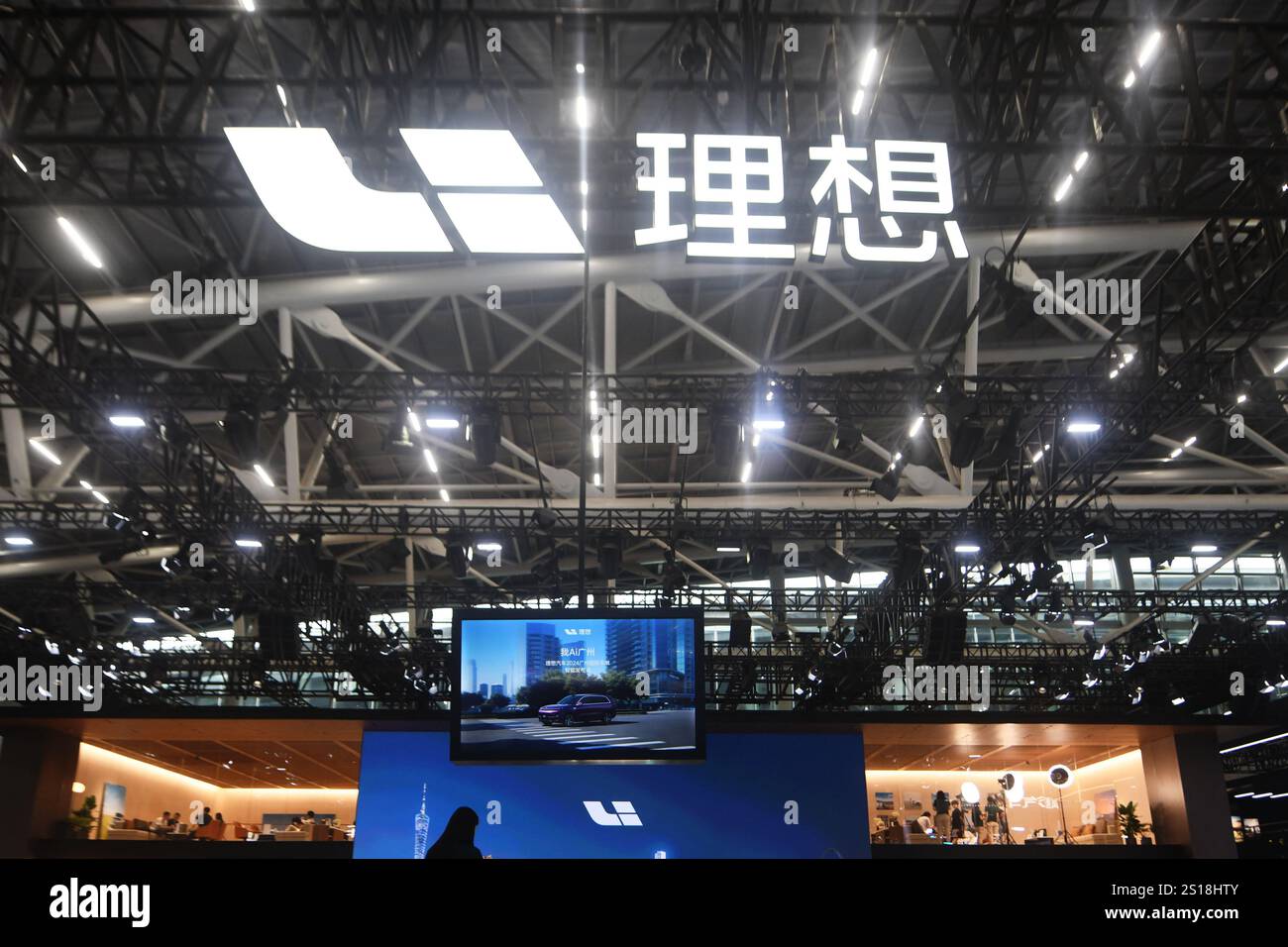 Visitors visit the Li Auto booth at the 2024 Guangzhou Auto Show in ...