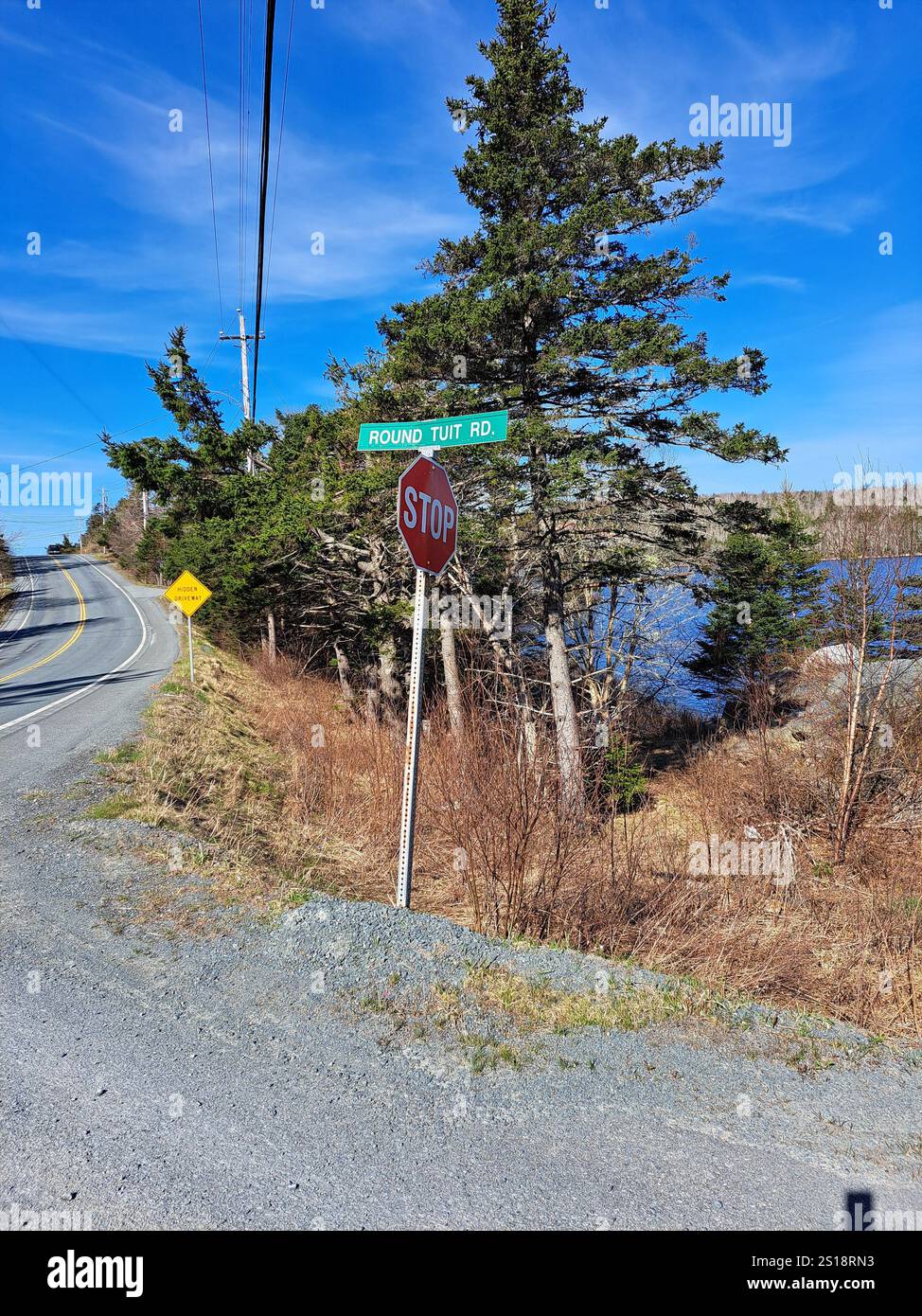 Round Tuit Road sign in Whites Lake, Nova Scotia, Canada Stock Photo