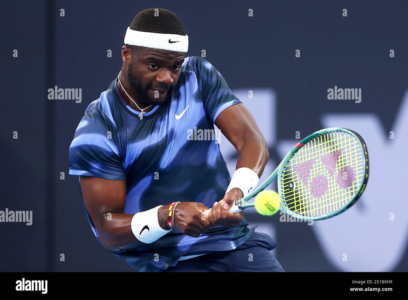Frances Tiafoe of the U.S. plays a backhand against France's Giovanni