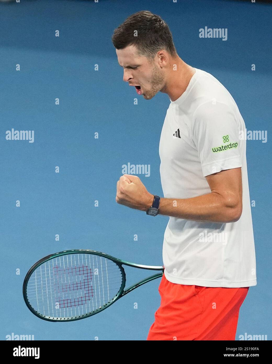 Poland's Hubert Hurkaz reacts after winning the first set aagainst
