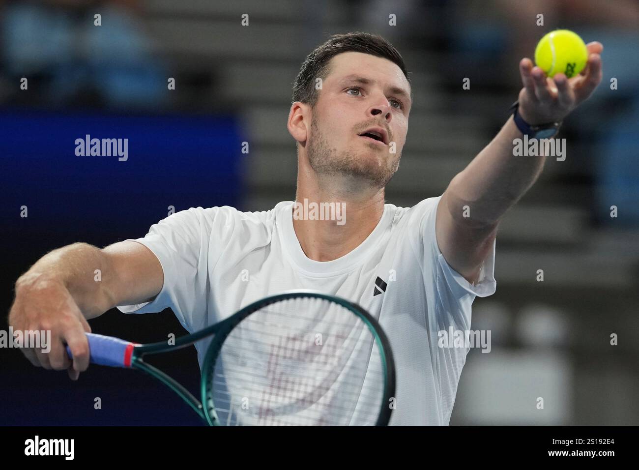 Poland's Hubert Hurkaz serves to Britain's Billy Harris during their