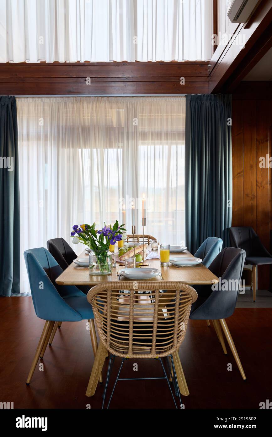 An Elegant and Modern Dining Room Featuring Charming Decor and Plenty ...