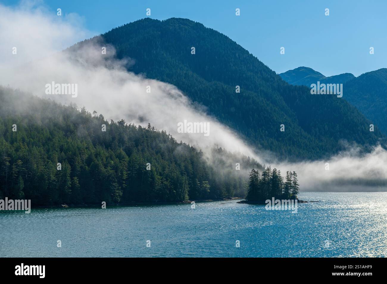 Morning mist along Inside Passage cruise between Prince Rupert and Port Hardy, British Columbia, Canada. Stock Photo