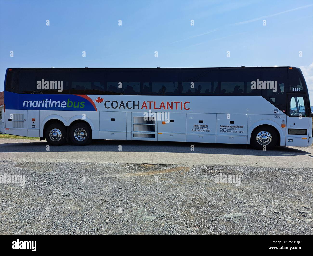 Maritime Coach Atlantic tour bus parked at Cape Bonavista Lighthouse in ...