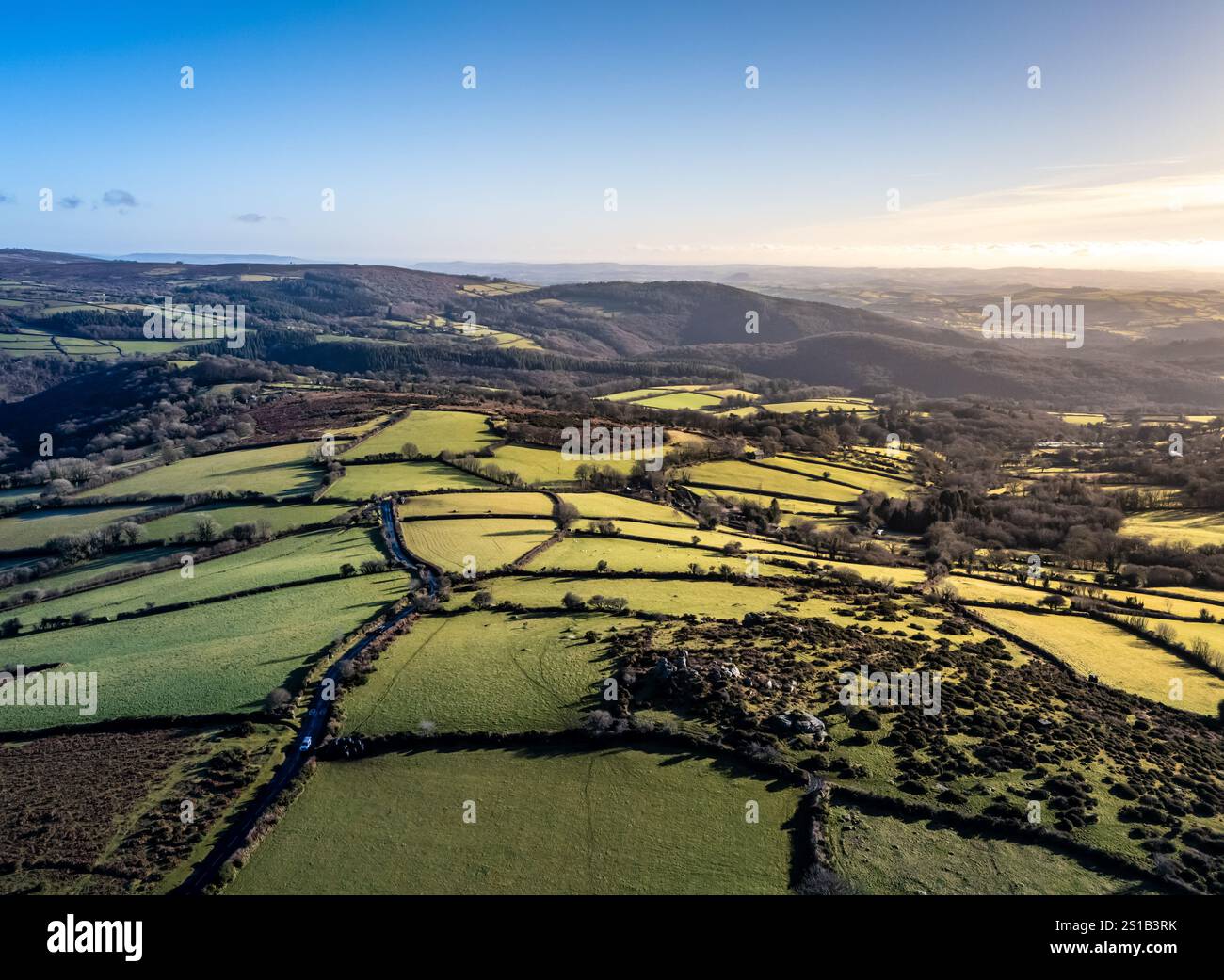 Dartmoor, UK. 2 January 2025. Winter sun over Sharp Tor on Dartmoor
