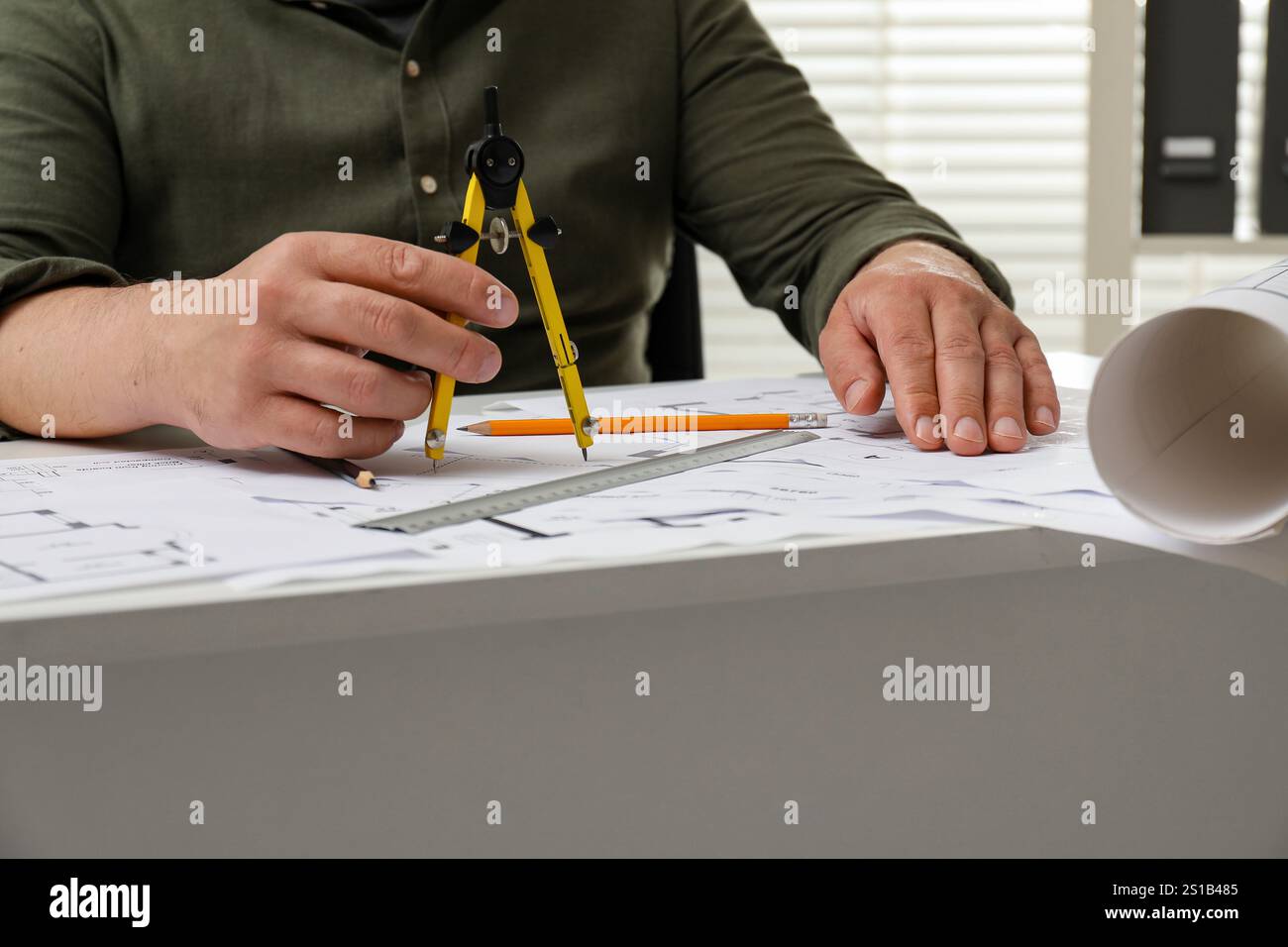 Architect working with project, closeup. Different technical drawings on table Stock Photo