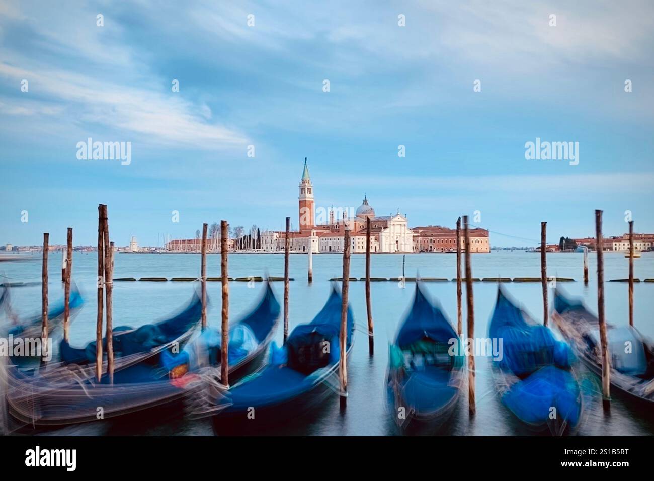 Long Exposure of boats and Basilica San Giorgio Maggiore church in background , Venice, Italy - Smartphone Captured Stock Image