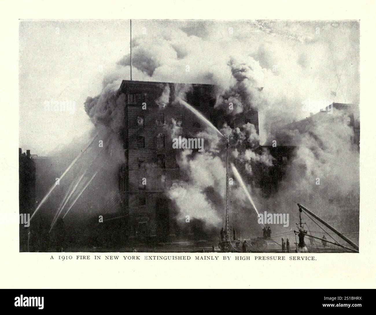 Large appartment building in New York Fire extinguished mainly by high pressure service.  1910 New York City Fire Department Operation, Archive Photograph. Stock Photo