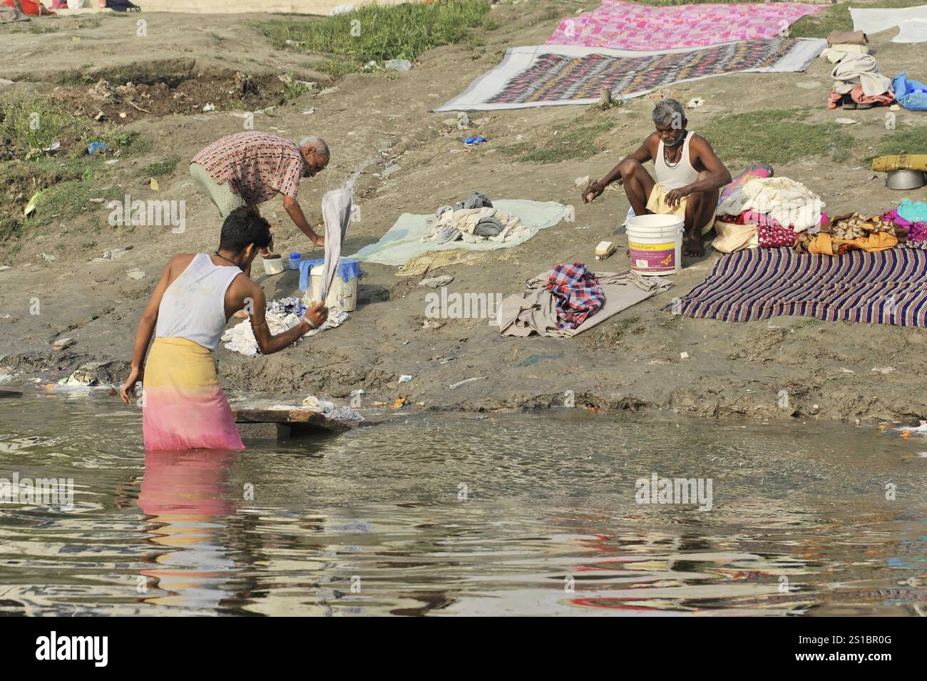 Varanasi, Uttar Pradesh, India, Asia, Men washing clothes on the river ...
