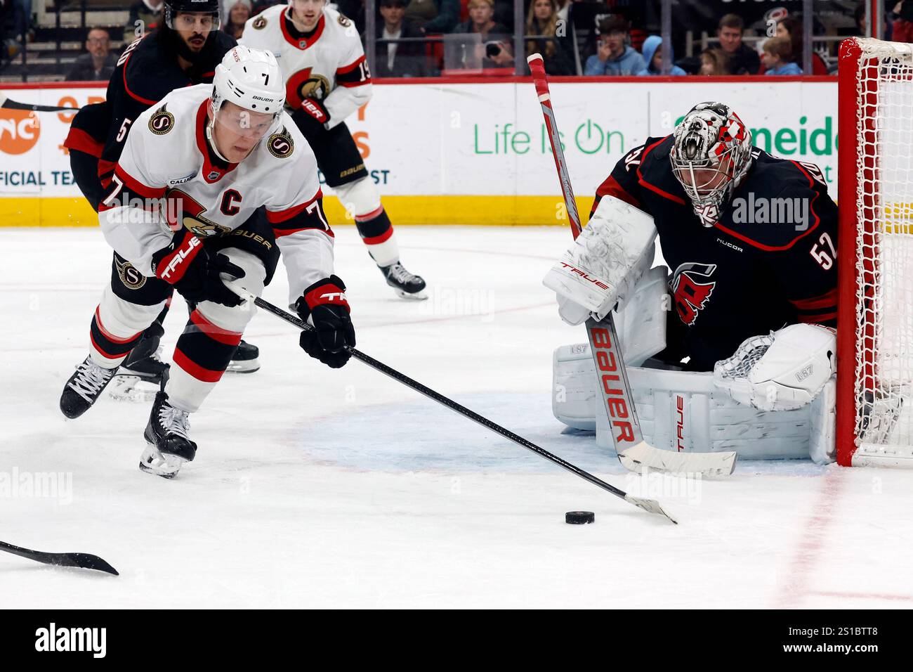 Ottawa Senators' Brady Tkachuk (7) looses control of the puck in front ...