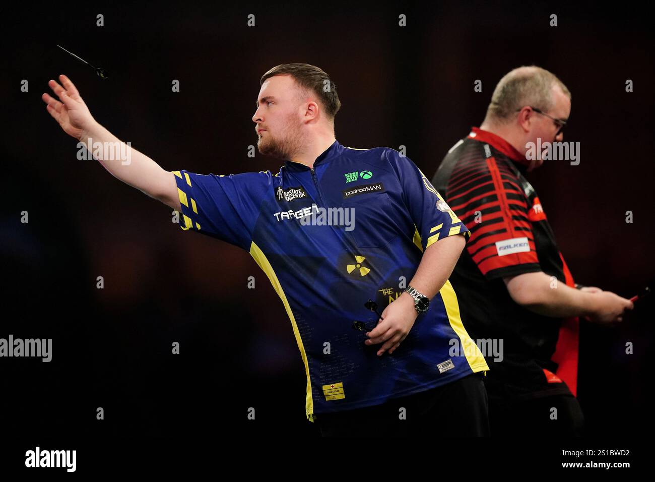 Luke Littler (left) in action during their semifinal match against