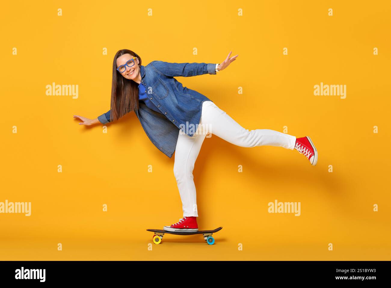 Riding penny board hi-res stock photography and images - Alamy