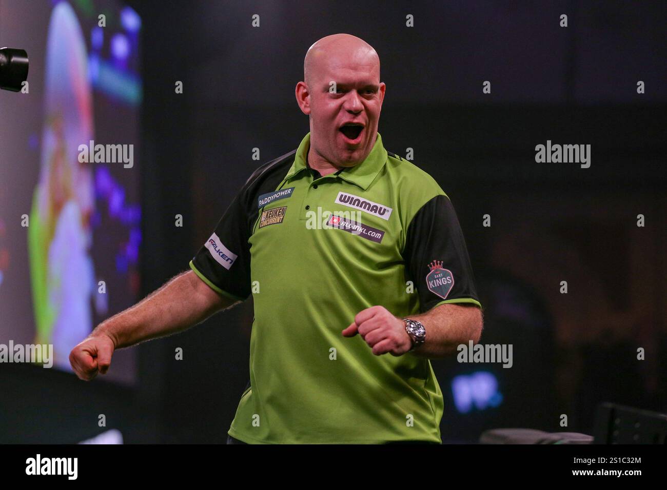 Michael van Gerwen celebrates winning the match during the Paddy Power