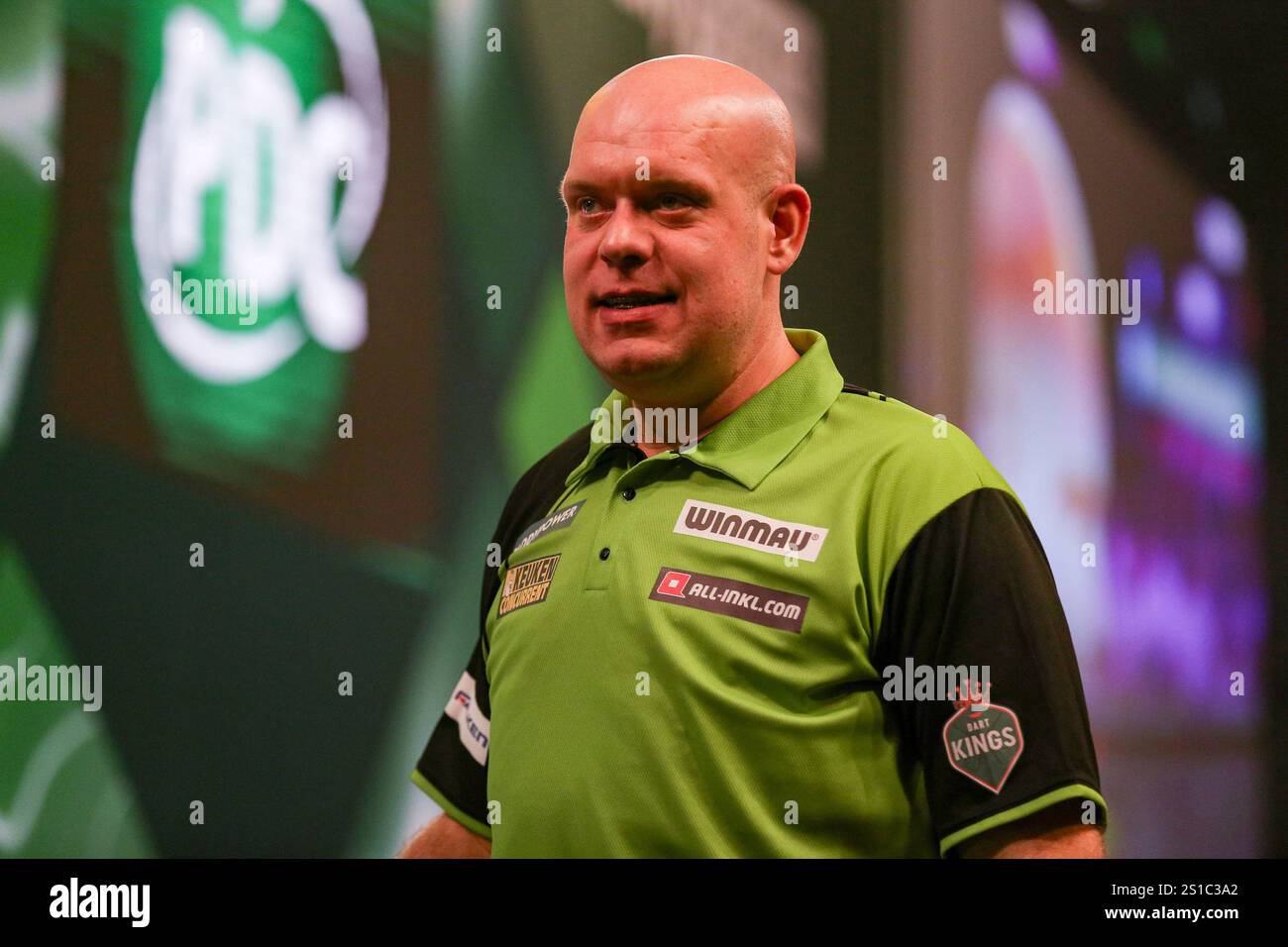 Michael van Gerwen celebrates winning the match during the Paddy Power