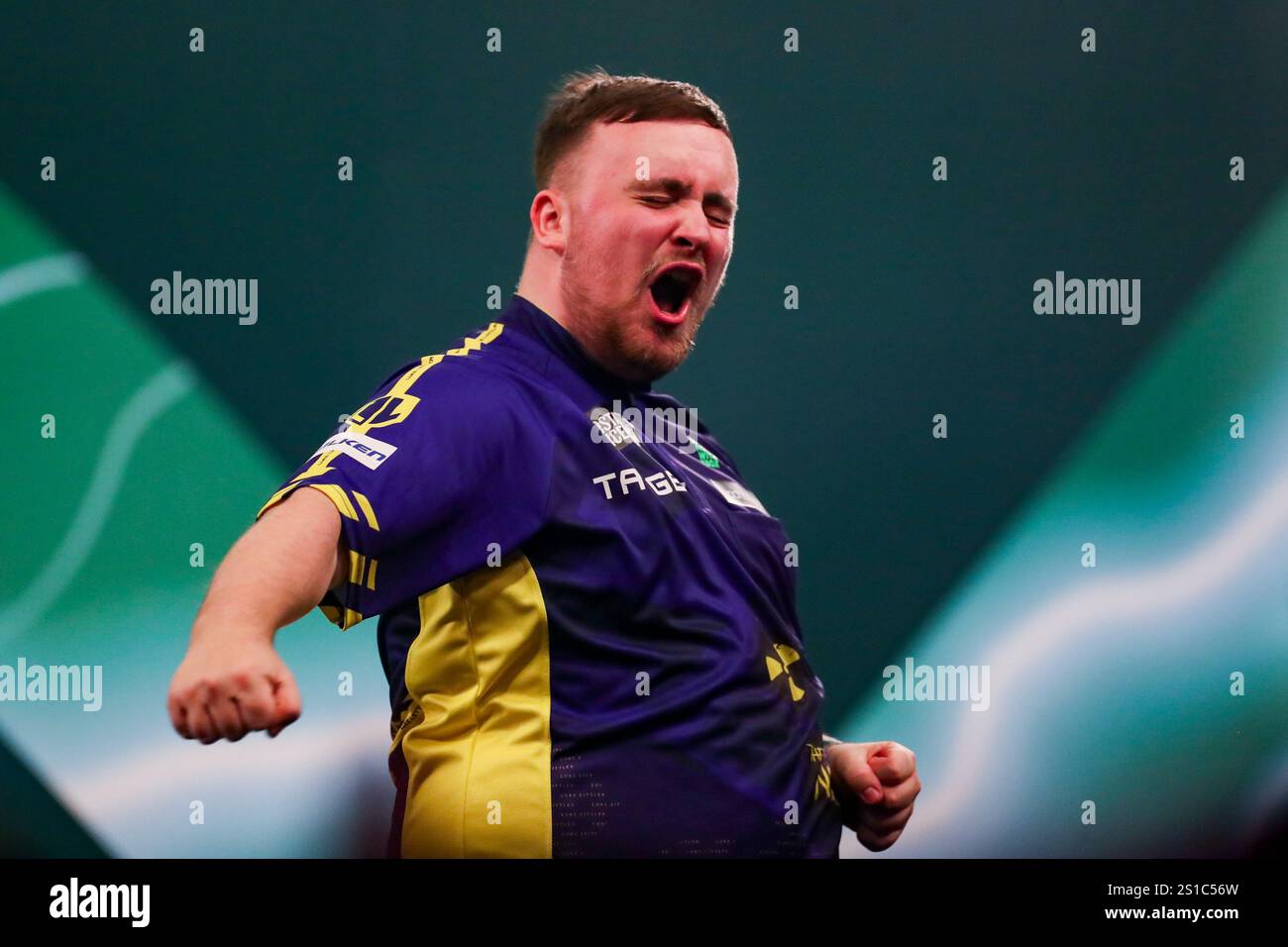 Luke Littler celebrates and gestures winning the match during the Paddy