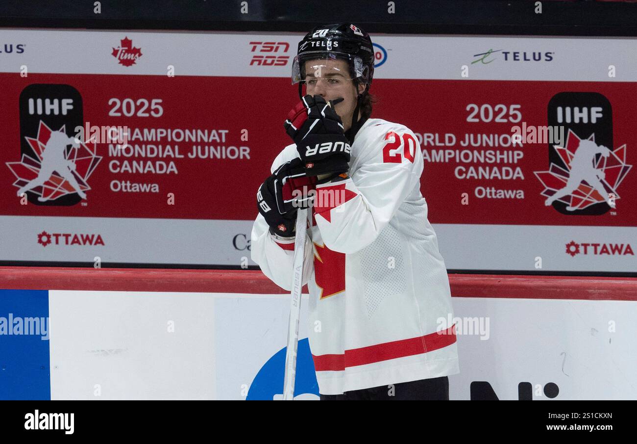 Canada forward Ethan Gauthier reacts following their 43 loss to the