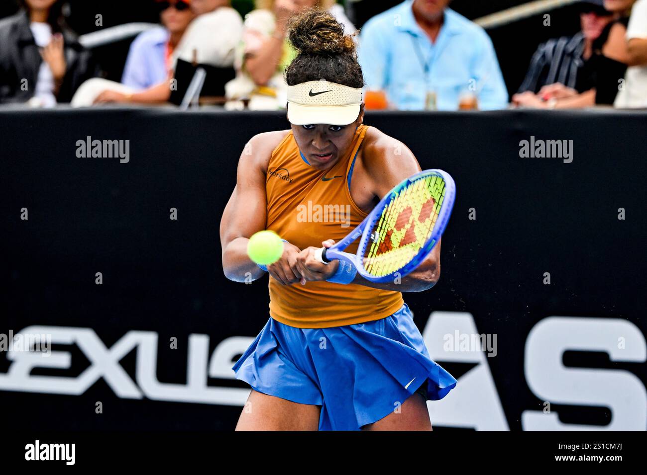 Naomi Osaka of Japan plays a shot against Hailey Baptiste of the U.S