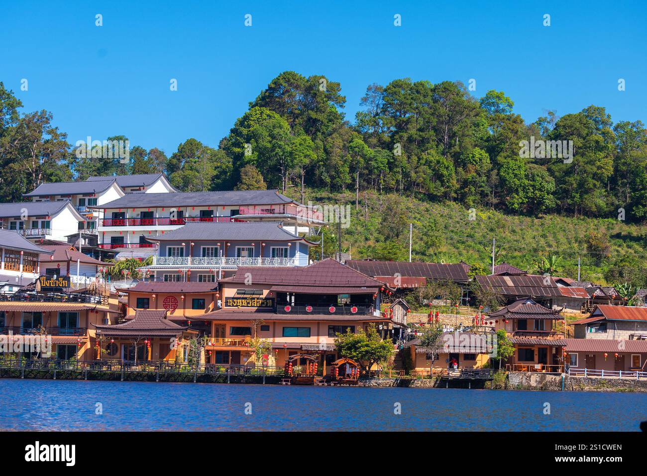 Chinese village of Ban Rak Thai with tea plantations and a lake ...