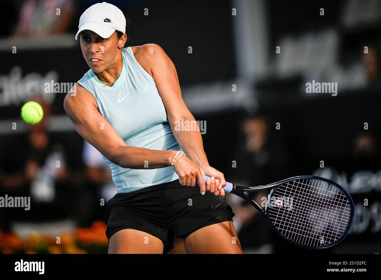 Madison Keys of the U.S. plays a shot against Clara Tauson of Denmark