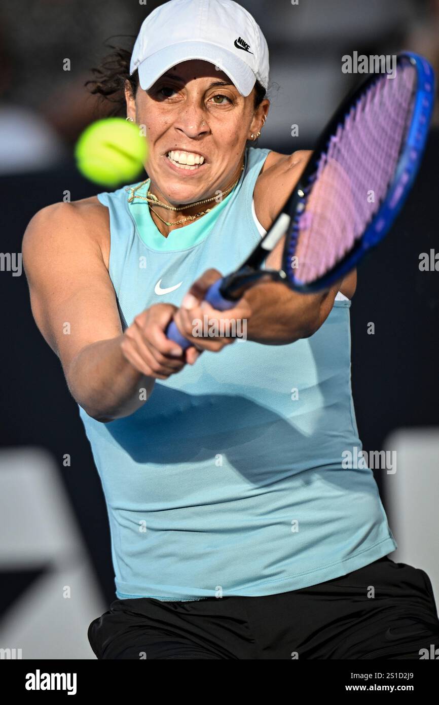 Madison Keys of the U.S. plays a shot against Clara Tauson of Denmark