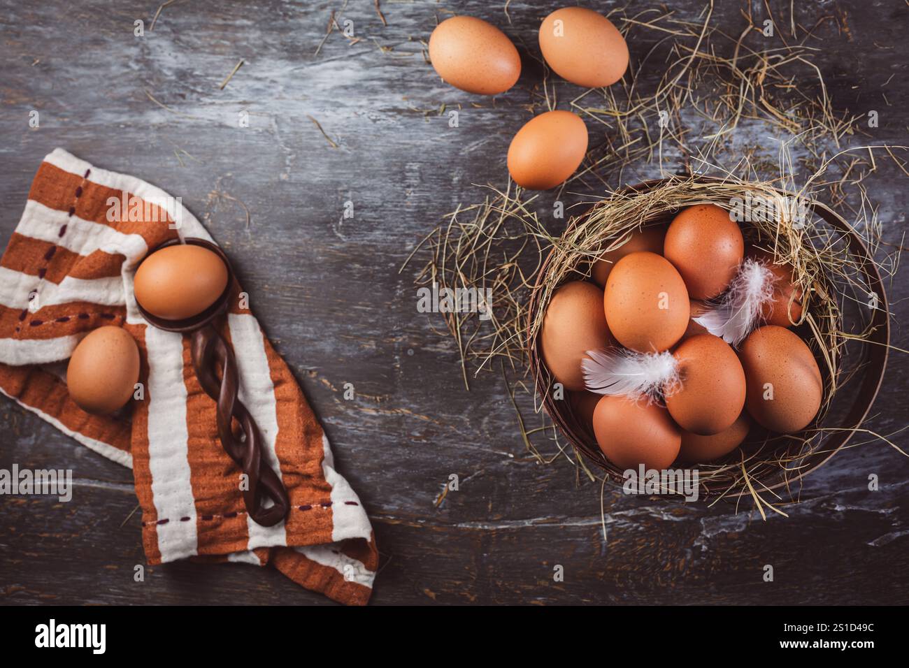 Organic brown eggs in a basket on kitchen table Stock Photo