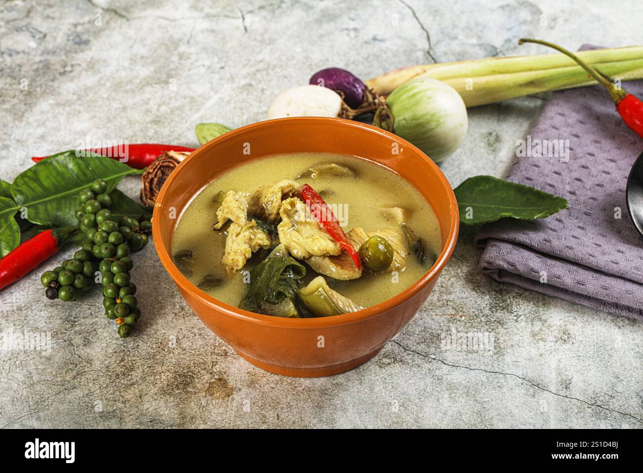 Thai green chicken curry with coconut milk and basil Stock Photo - Alamy