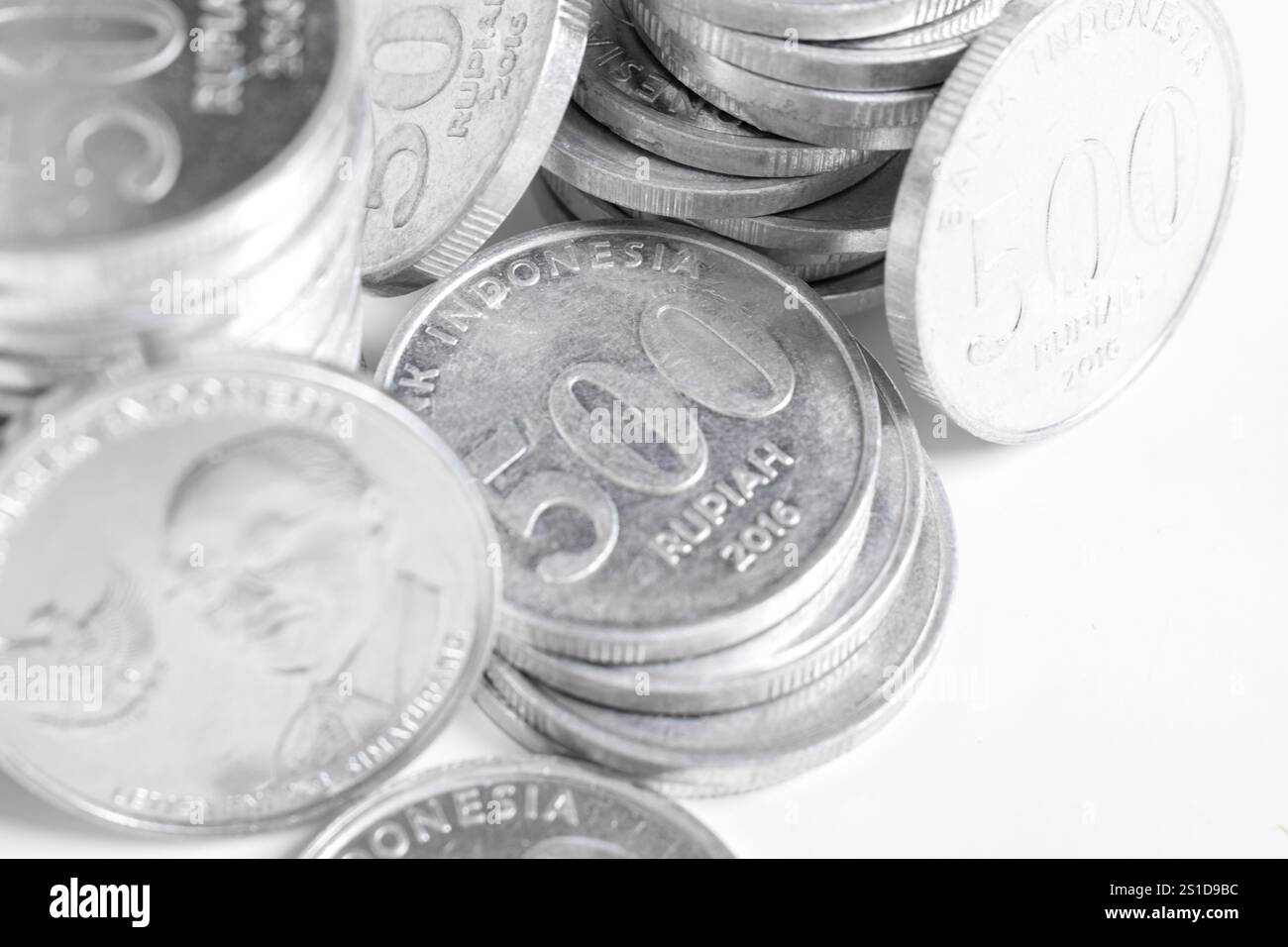 Silver coins stacks isolated on a white background. Indonesian rupiah ...