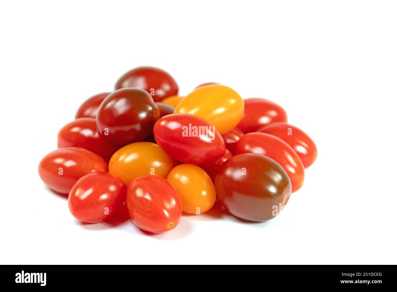Various mini tomatoes against a white background Stock Photo