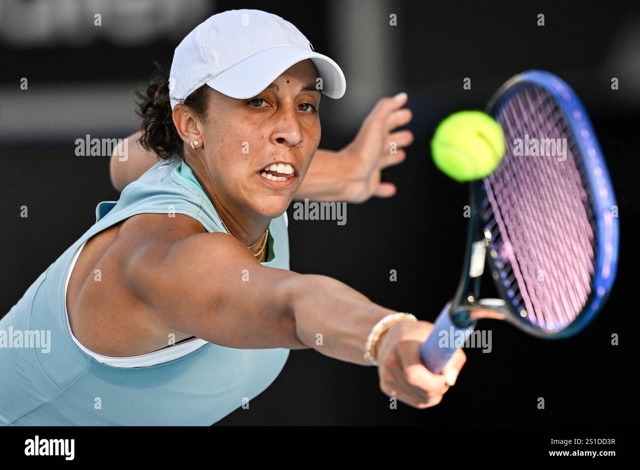 Madison Keys of the U.S. plays a shot against Clara Tauson of Denmark