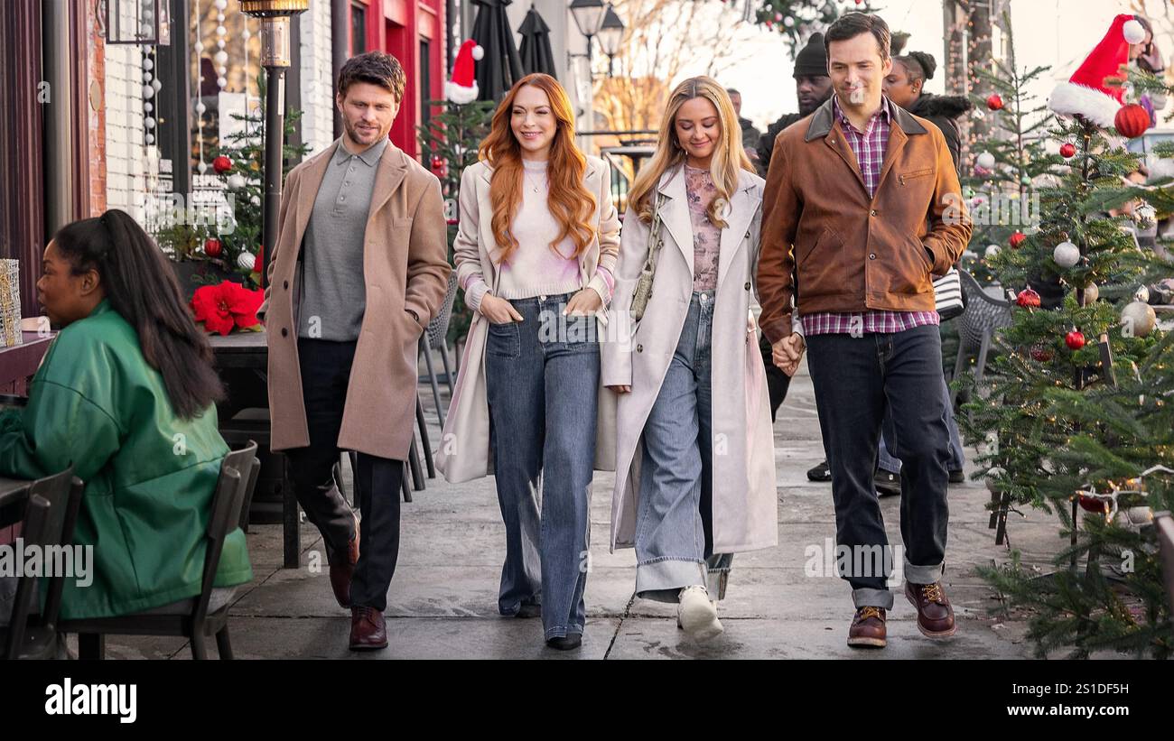 LINDSAY LOHAN, IAN HARDING, JON RUDNITSKY and KATIE BAKER in OUR LITTLE SECRET (2024), directed by STEPHEN HEREK. Credit: Capital Arts Entertainment / Netflix / Album Stock Photo